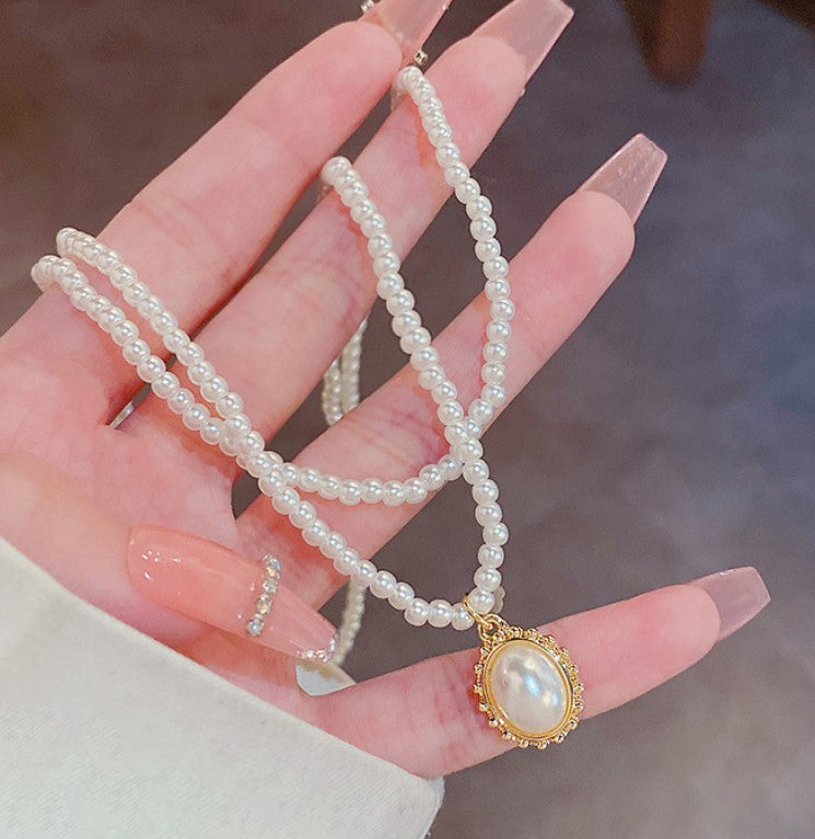 MULTILAYER WHITE PEARL NECKLACE