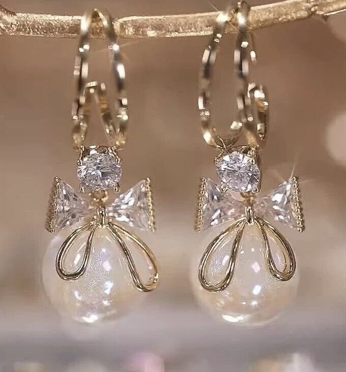 Pearl Bow Tie Dangling Earrings