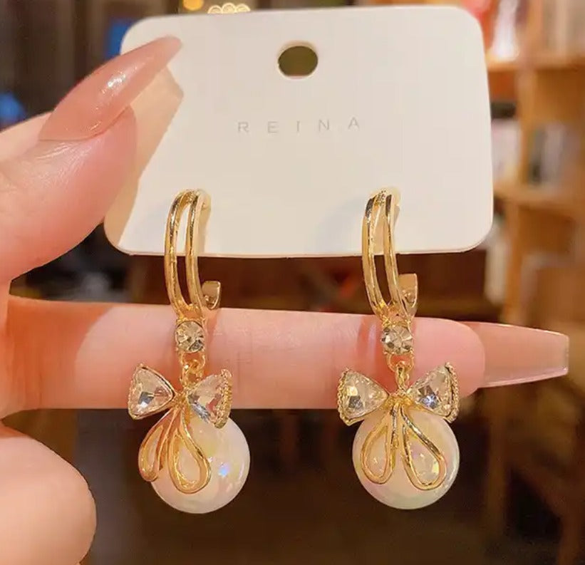 Pearl Bow Tie Dangling Earrings